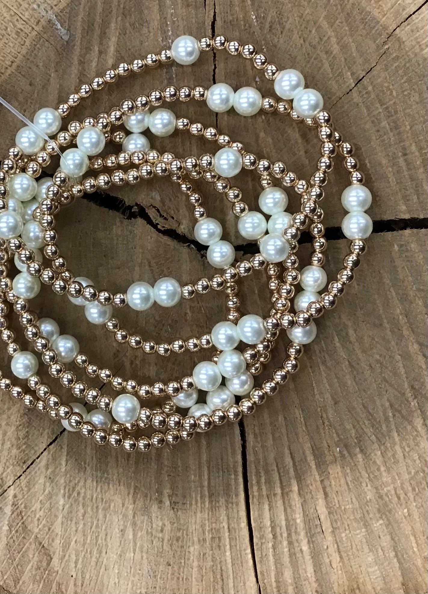 Set Of 7 Pearl/Gold Breaded Bracelets